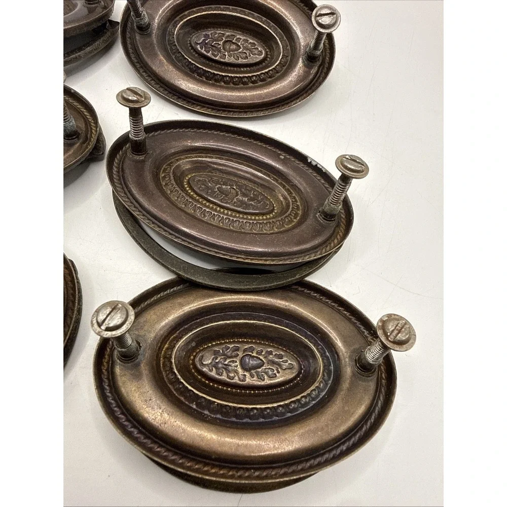 Antique Hepplewhite-style drawer pulls embossed oval backplate